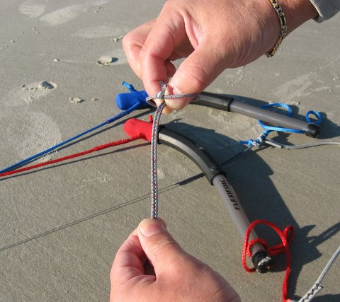 tutorial photo 2 of forming a loop with thumb and forefinger for a larks head knot